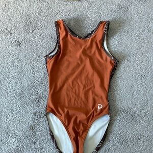Plum gymnastics leotards